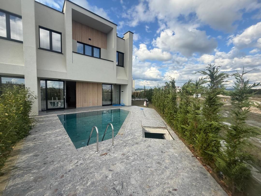 <p>This Residential Complex which is being realized and being built in Qerret e Kavajes and consists of Premium Villas with Swimming Pools. This villa is located within this complex which has internal administration and 24/7 security. The property is organized on 2 floors where the first floor has 1 living room (open - space), 1 kitchen corner which have direct access to the swimming pool and 1 toilet. The second floor which offers a relaxing view directly from the swimming pool and the surrounding greenery, has 3 bedrooms where one has a personal toilet and also has 1 shared toilet. Its total area is 148 m2, while the construction area has 134.7 m2 where the first floor has a surface of 69 m2 and the second floor 65.7 m2. This villa also offers 2 Parking Places included in the price offered, which makes this villa an oasis of privacy and tranquility that this Residence offers. The area in which the villa is located is a quiet, comfortable, safe area surrounded by such 2-story villas / duplexes. The construction was carried out with the latest techniques of European building codes, invested in every detail (hoods, triplex windows, etc.) to make it suitable for both residence and vacation home, it can also be a very good business option for daily rental with a small appropriate investment.<br>The property has regular mortgage documentation and is ready for sale.<br><br>For more information or a visit to the property, do not hesitate to contact us!</p>