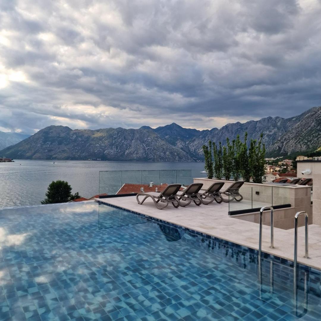 <p>Discover the epitome of coastal elegance with this stunning penthouse apartment located in the heart of Dobrota, Kotor. Set in a brand-new residential building, this exclusive property offers panoramic sea views, premium finishes, and a lifestyle of unmatched comfort and convenience.</p><p>This beautifully furnished penthouse features a private pool, spacious parking space, and is equipped with a state-of-the-art smart home system for modern living. Just a short walk to the sea, it’s the perfect retreat for those seeking a serene and stylish residence on the Montenegrin coast.</p><p>Key Features:</p><p>Breathtaking panoramic views of the Bay of Kotor</p><p>Private swimming pool for ultimate privacy and relaxation</p><p>Secure private parking space</p><p>Fully furnished with high-quality interior design</p><p>Smart home system for lighting, climate, and security control</p><p>Located in a new, modern building with premium construction quality</p><p>Just walking distance to the sea, cafes, and promenade</p><p>Ideal as a primary residence, holiday home, or investment property, this penthouse combines sophisticated living with one of the most desirable locations in Montenegro.</p>