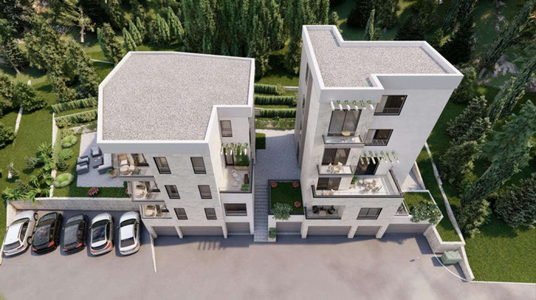 <p>The project is an exclusive residential complex located in one of the most picturesque areas of Tivat. Modern architecture, high-quality materials, and well-thought-out layouts create the perfect space for comfortable living.</p><p><br>Advantages of the Complex:</p><p><br>Prime Location: Just a few minutes’ walk from the beaches, restaurants, and the Porto Montenegro waterfront.</p><p><br>High-End Finishes: Natural stone, premium sanitary ware, and climate systems from leading global brands.</p><p><br>Functional Layouts: Maximum use of space and natural light thanks to panoramic windows.</p><p><br>Professional Management: The complex will be maintained by an experienced property management company.</p><p><br>Location</p><p><br>The residential complex is situated in a quiet and green area of Tivat, surrounded by scenic nature and prestigious developments.<br>Shops, restaurants, clean beaches, and the world-renowned Porto Montenegro marina — one of the most elite ports in Europe — are all within walking distance.<br>Tivat International Airport is just a 10-minute drive away, ensuring maximum travel convenience.<br>By choosing Tivat as your new home, you become part of a dynamically developing resort with modern infrastructure — where every day is filled with comfort and new experiences.<br><br>About the Complex<br>The complex consists of two buildings — Block A and Block B.<br>Each block offers one- and two-bedroom apartments with spacious living rooms and terraces.<br>Ground floor units feature private patios.<br>Available apartments range from 42 m² to 90 m².<br>Thanks to panoramic glazing, all apartments are filled with natural light throughout the day. Most units offer breathtaking views of the sea and the city.<br>&nbsp;</p>