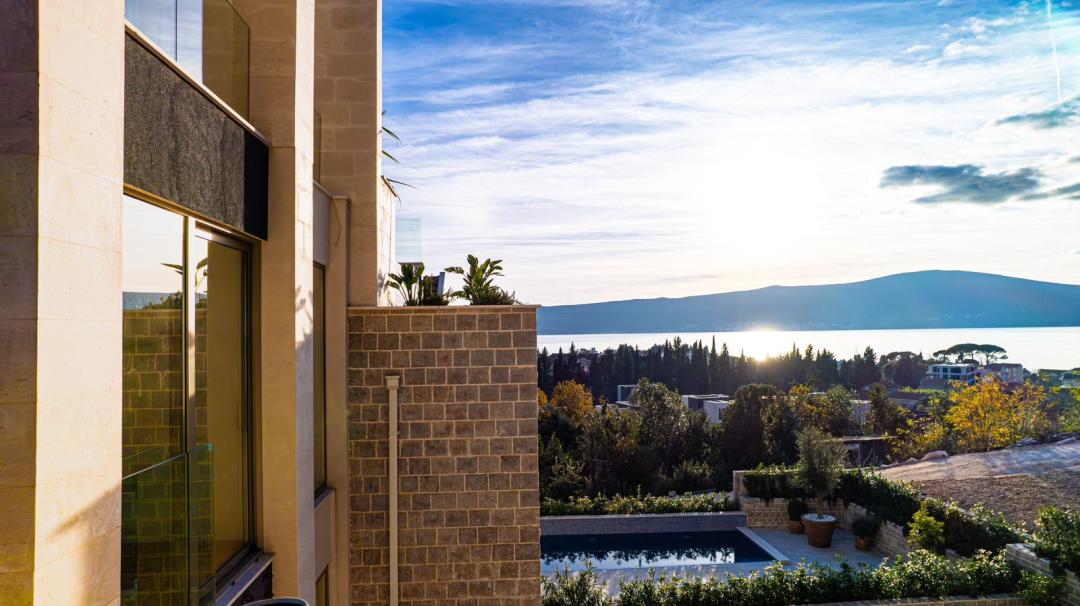 <p>The complex is located within walking distance from the promenade with stunning views of the sea and the unique marina of Porto Montenegro.</p><p>The reliability of modern structures and materials combined with authentic design elements is the main feature of the project. The complex is designed in such a way that, thanks to panoramic windows and numerous terraces, you can enjoy a magnificent view of the sea, and every square meter of the<br>complex is filled with sun.<br>Modern architectural forms and technologies are harmoniously combined with traditional stone and wooden elements. We have achieved the perfect combination of architecture and surrounding landscape. The reliability of modern structures and materials combined with authentic design elements is the main feature of the project.</p><p>The project is located on a land plot with a total area of 10,000 sq. meters. The construction of the complex is carried out in three stages:<br>1st stage - 9 townhouses (ready for occupancy in December 2023);<br>2nd stage - 8 apartments and 4 penthouses (beginning of construction -<br>January 2024 – completion - December 2026);<br>3rd stage - 4 exclusive villas (2 villas under construction).</p><p>There are 2-3-floors townhouses to choose from,<br>which include:<br>• living room with kitchen and dining area,<br>• 2 or 3 bedrooms with bathrooms,<br>• underground and guest parking,<br>• spacious outdoor terraces,<br>• private pool<br>(on the terrace or on the roof).</p><p>&nbsp;</p><p>Townhouses are equipped with Daikin air conditioning systems, Villeroy & Boch plumbing, Alumil windows, Shelly smart home system, AEG household appliances, Italian Composit kitchens with an exclusive design, Italian oak parquet, heated floors.<br>Townhouse area is from 240 up to 350 sq.m. Upon request and for anadditional fee, townhouses can be fully furnished.</p><p>&nbsp;</p><p>The distance to the seashore is 450 meters. Porto Montenegro is 1,5 km away, Tivat airport 5 km, Podgorica airport 84 km and Dubrovnik airport 69 km.<br>Knightsbridge International School, playgrounds, tennis courts, fitness clubs, pharmacies, shops, restaurants are located within walking distance<br>from the complex.<br>The project residential complex will give future owners a feeling of unsurpassed comfort surrounded by evergreen forests, rocky mountains, wind, sea water and the varied colors of the Adriatic.</p><p>&nbsp;</p>