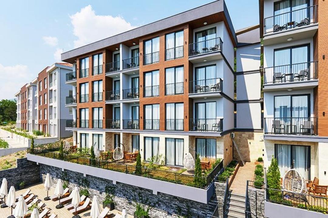 <p>A short break in the heart of Montenegro with The luxury residential all inclusive project.</p><p>An unforgettable holiday experience intertwined with peace, nature and luxury in Tivat, the pearl of Montenegro. You will rest your soul as well as your body in the luxurious rooms of The project, which are prepared considering all your needs. The project is waiting for you with its luxurious lines, the touch of modern archite cture and breathtaking nature.</p><p>The project offers not only an accommodation but also a unique holiday experience with its fine details. Your holiday will be filled with The project with its breathtaking Adriatic view, gardens and terraces that host pleasant moments, a swimming pool located in the best part of the view, sauna and fitness rooms that will make you feel at home.</p><p>You will feel the comfort of luxury in the suites, which have been designed with all your needs in mind, from the kitchen to the bathroom. With 5 different room plans, you will be able to plan the holiday you want according to the number of people. You will always feel the unique view of Tivat and the cool breezes of the Adriatic. You will have a wonderful holiday where your calm and privacy are protected. You will rest both your body and soul in our suites, which are planned with relaxing and modern designs.</p><p>&nbsp;</p><p><strong>What awaits you at The project?</strong></p><ul><li>You will renew both your soul and body with a relaxing atmosphere and our special services.</li><li>You will start the day more positive with the breathtaking Adriatic view.</li><li>You will relax as you wish with our sauna, massage room, spa rest area, fitness room, outdoor swimming pool, garden rest areas and terrace rest areas.</li><li>You will not have parking problems for your vehicle with our open-closed parking areas.</li><li>You will feel the comfort in every area with our reception and housekeeping services.</li><li>You will combine your holiday safely with our smoke alarm, fire extinguishers, security camera, safety deposit box and 24-hour security service.</li></ul><p><strong>Infinity Pool</strong></p><ul><li>You will be able to enjoy the view of the Adriatic while sitting on your sun lounger and sipping your wine.</li><li>You will be safe with sun umbrellas.</li><li>Entertainment will always be with you with our live music and shows.</li><li>You will enjoy cooling off in our 100 m2 endless infinity pool designed for those who love the sea but do not like sand.</li></ul><p>&nbsp;</p>